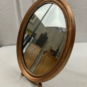 Oval Gold tone vintage dresser mirror framed with feet & stand